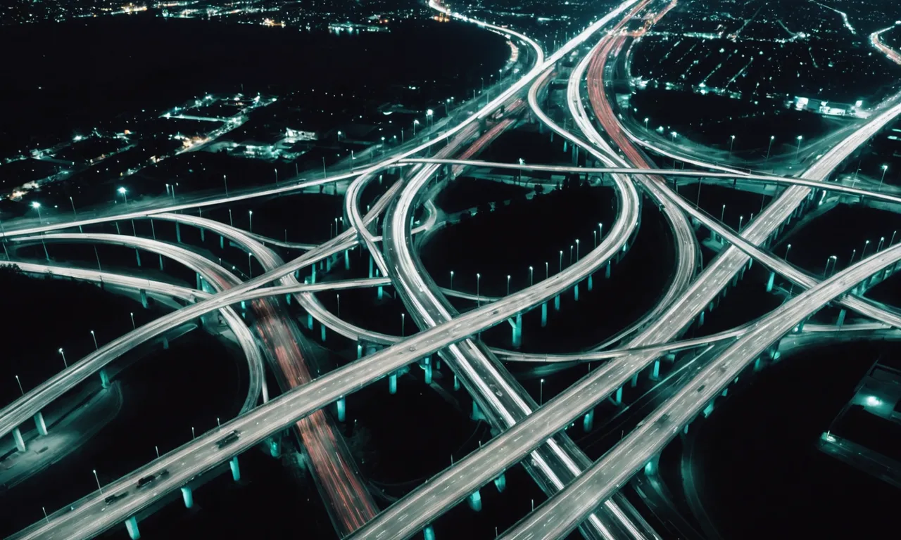 Aerial night view of a highway interchange where light trails from every direction converge, representing clicks from every link rolling up into one view