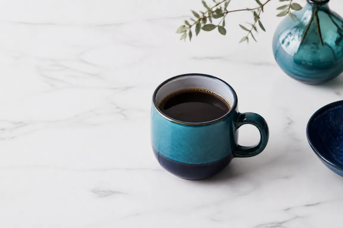 Ceramic mug on white marble