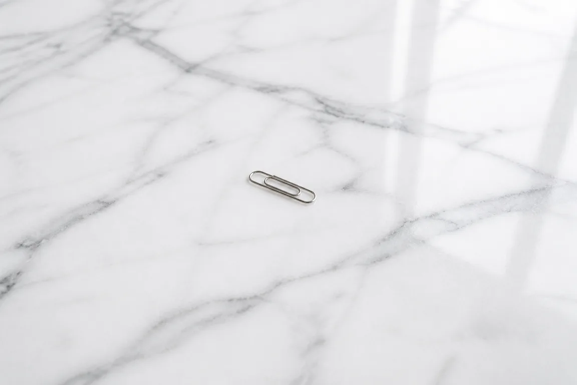 Paperclip on a blank notepad